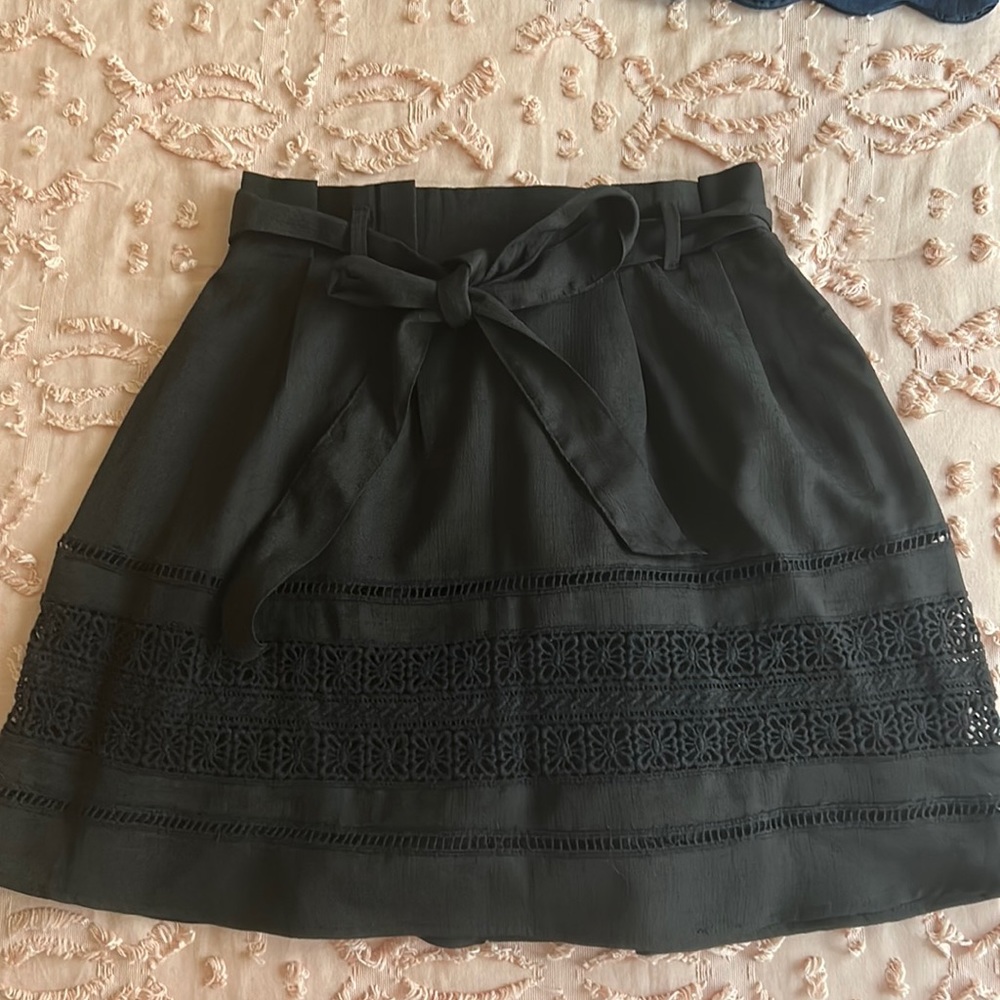 Adorable black shirt with lace detail and bow